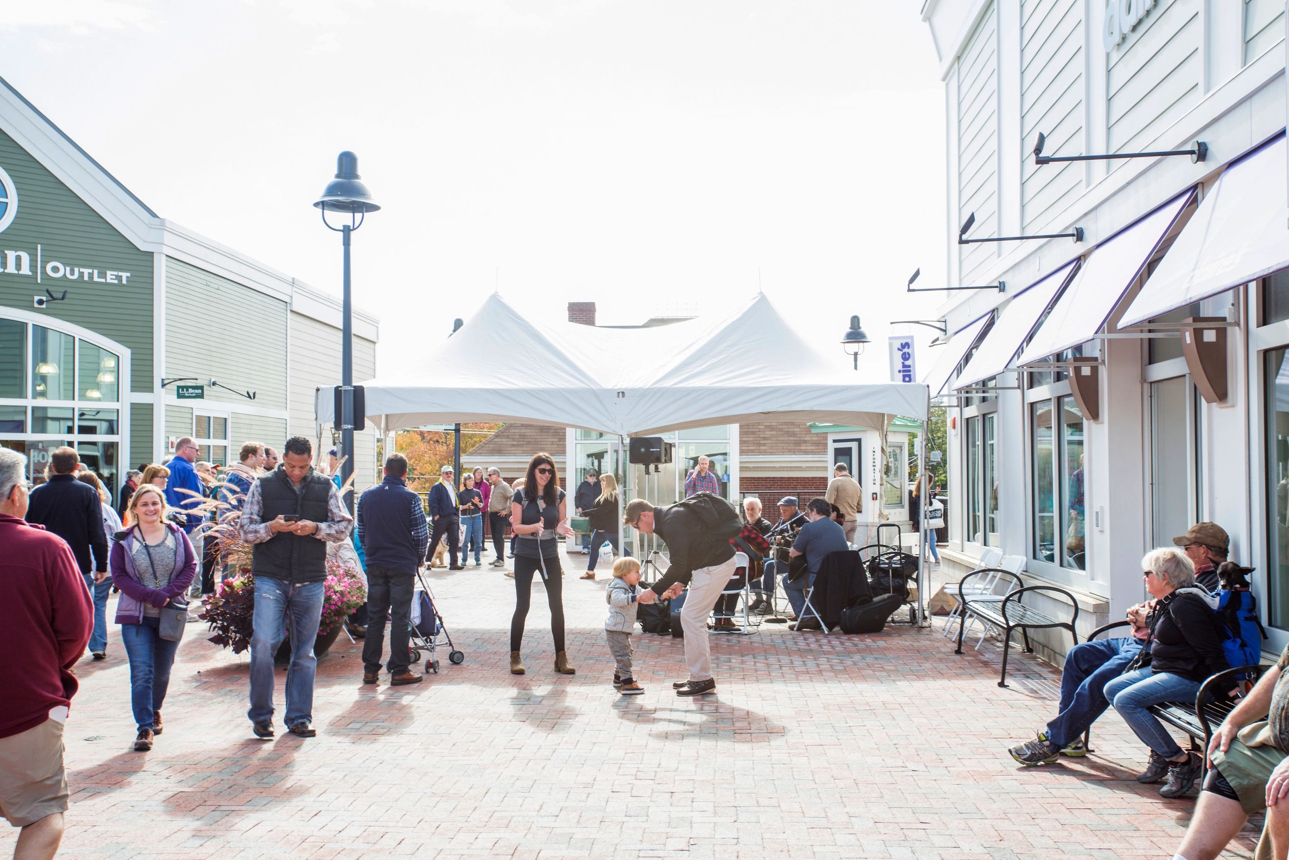 Shoppers at a vibrant outdoor retail center